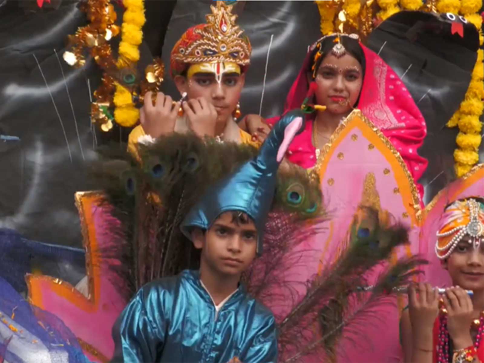 Children dressed as Lord Krishna and Radha participate in a Shobha Yatra during Janmashtami festivities in Udhampur (Photo/ANI)