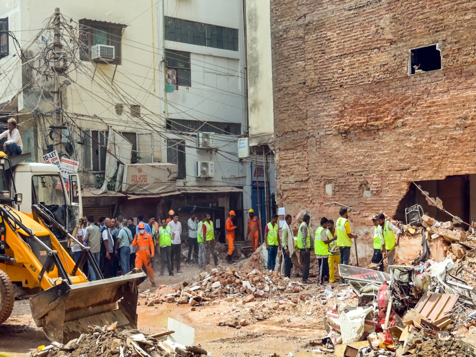 Visuals from the Satya Niketan building collapse site (Photo/ANI)