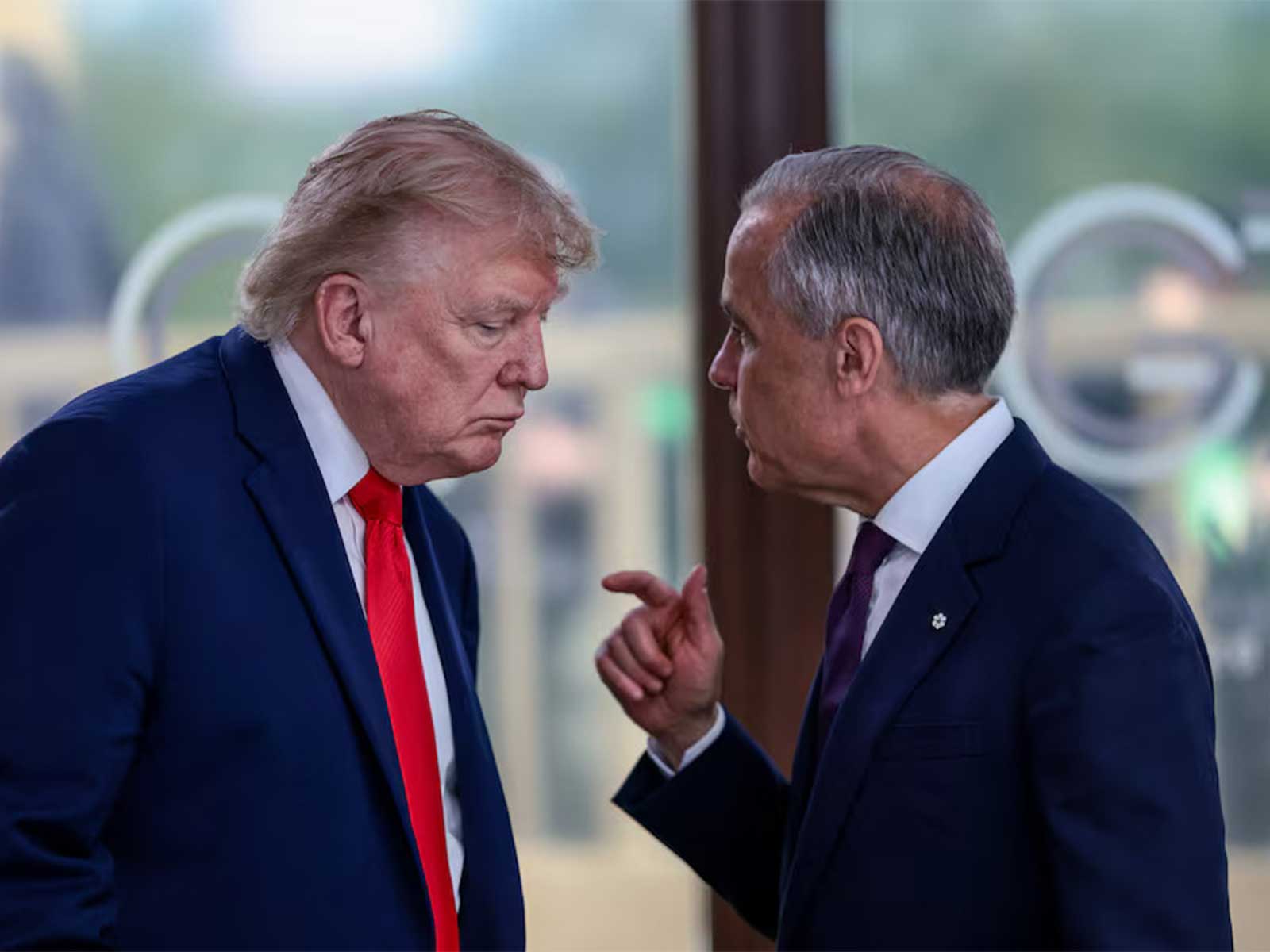 US President Donald Trump speaks with Canadian Prime Minister Mark Carney during a working lunch alongside G7 and Middle East leaders in Evian-les-Bains, France. (File Photo/Reuters)