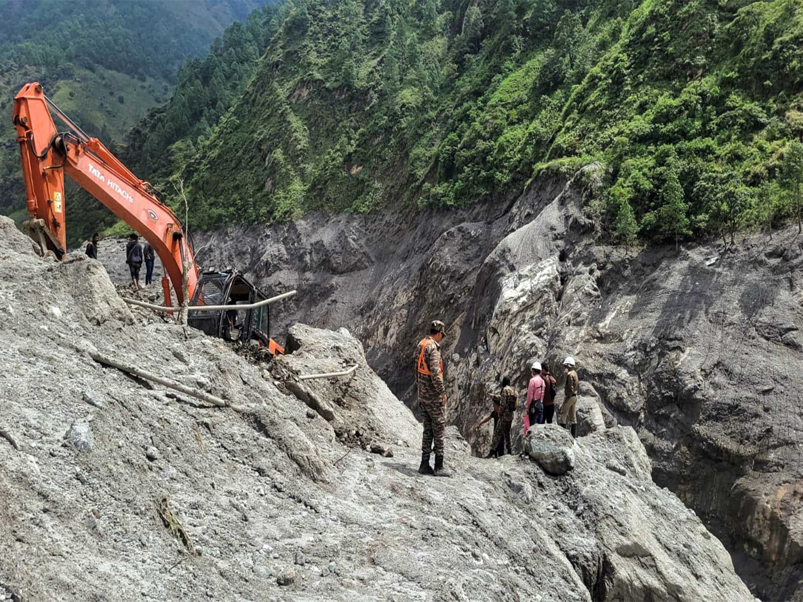 A joint team of India and Nepal works to construct the road towards the flood-hit hydropower tunnel as part of rescue operations, at Chilime in Rasuwa (File Photo/ANI)
