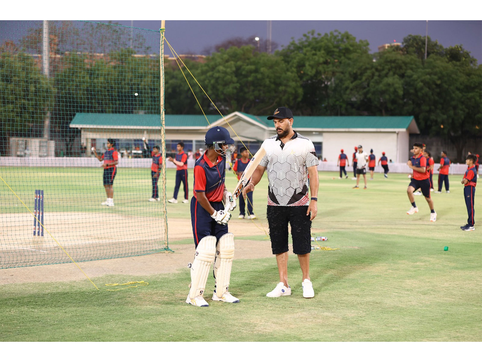 Yuvraj Singh with YSCE students during a practice session on the cricket ground