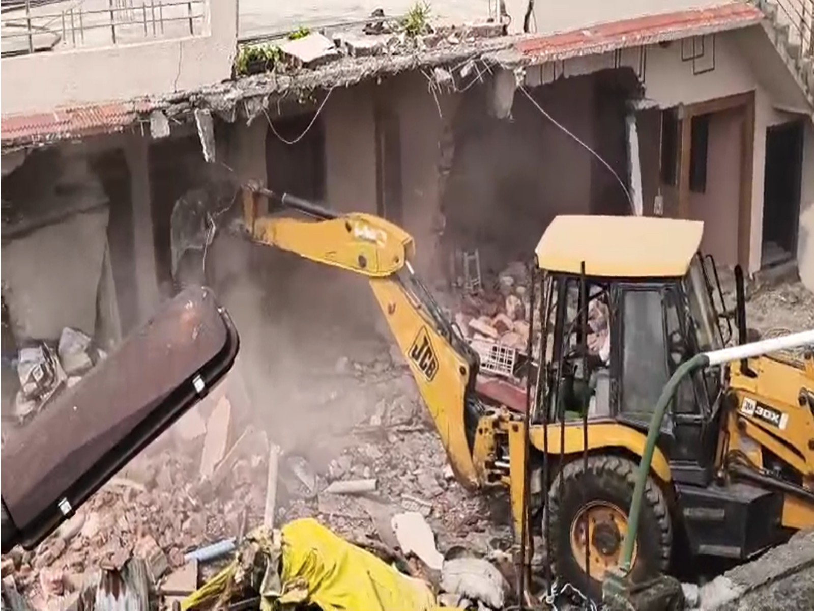 Illegal encroachment being removed (Photo/ANI)