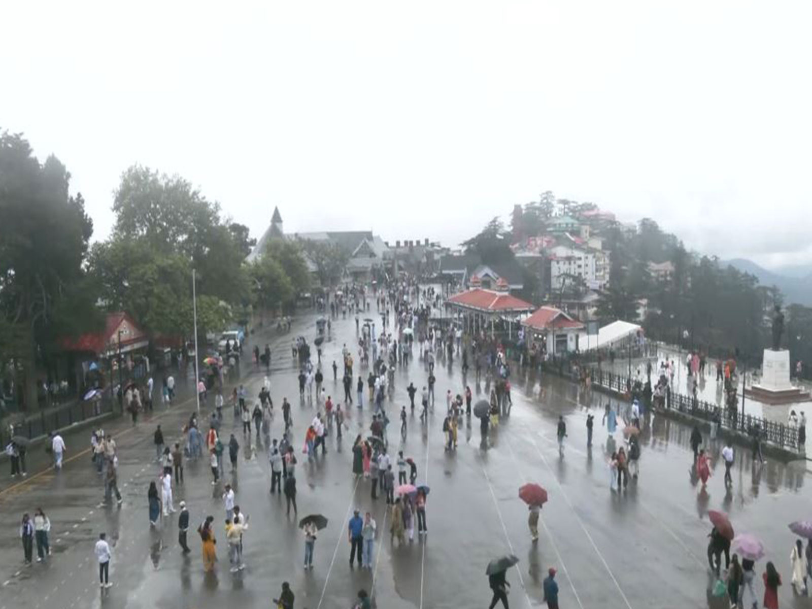 Tourists enjoy pleasant weather after rain in Shimla (Photo/ANI)
