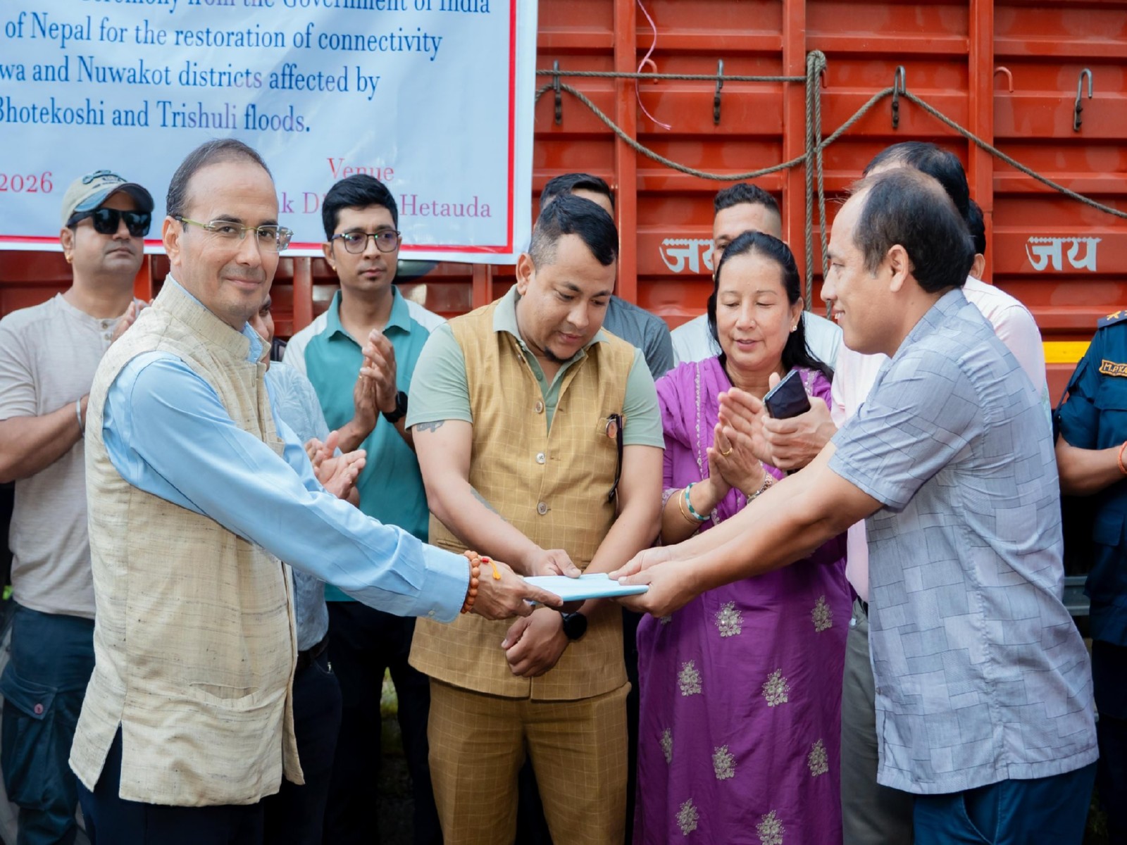 Officials from the Indian Embassy hand over the first consignment of a 70-metre Bailey bridge to Nepal authorities to restore flood-hit road connectivity (Photo/@navsri6619)