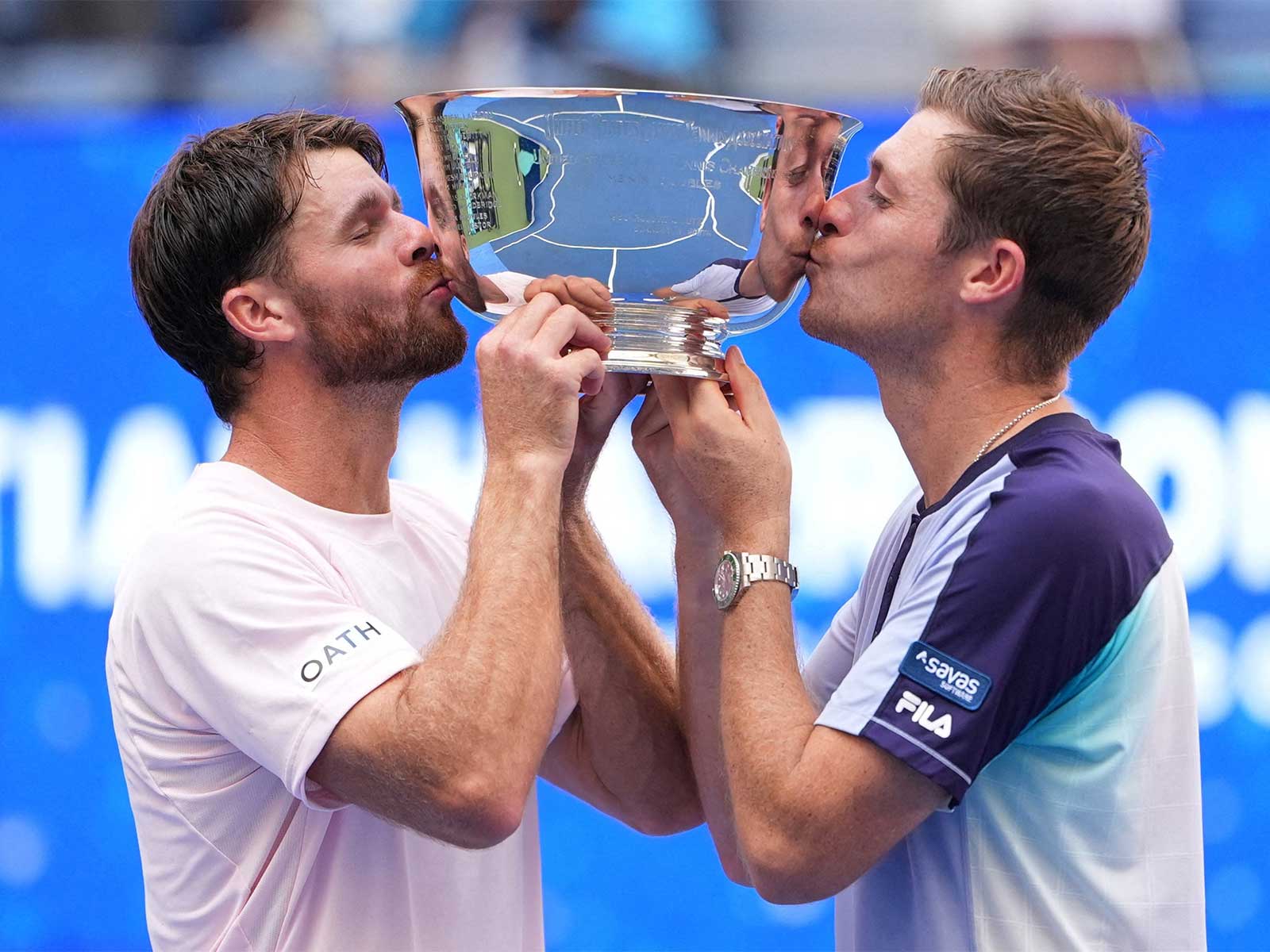 Christian Harrison (L) and Neal Skupski celebrate with the trophy after winning their US Open doubles final (Photo: Reuters)