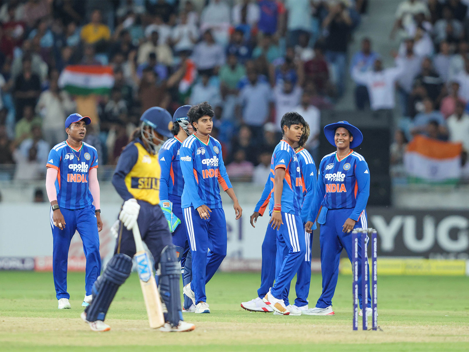 Sri Lanka's Harshitha Samarawickrama walks as Indian players celebrate her wicket during the Women's Asia Cup 2026 final (Photo: X/ @BCCIWomen)