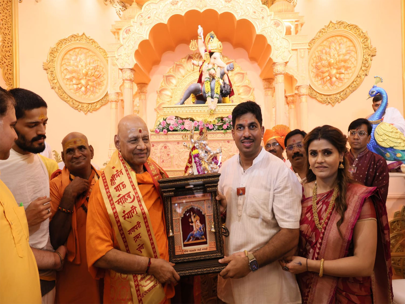 Spiritual leader Swami Govind Dev Giri Maharaj offers prayers at Shreemant Bhausaheb Rangari Ganpati Mandal during Ganeshotsav celebrations in Pune, Maharashtra. (Photo/ANI)