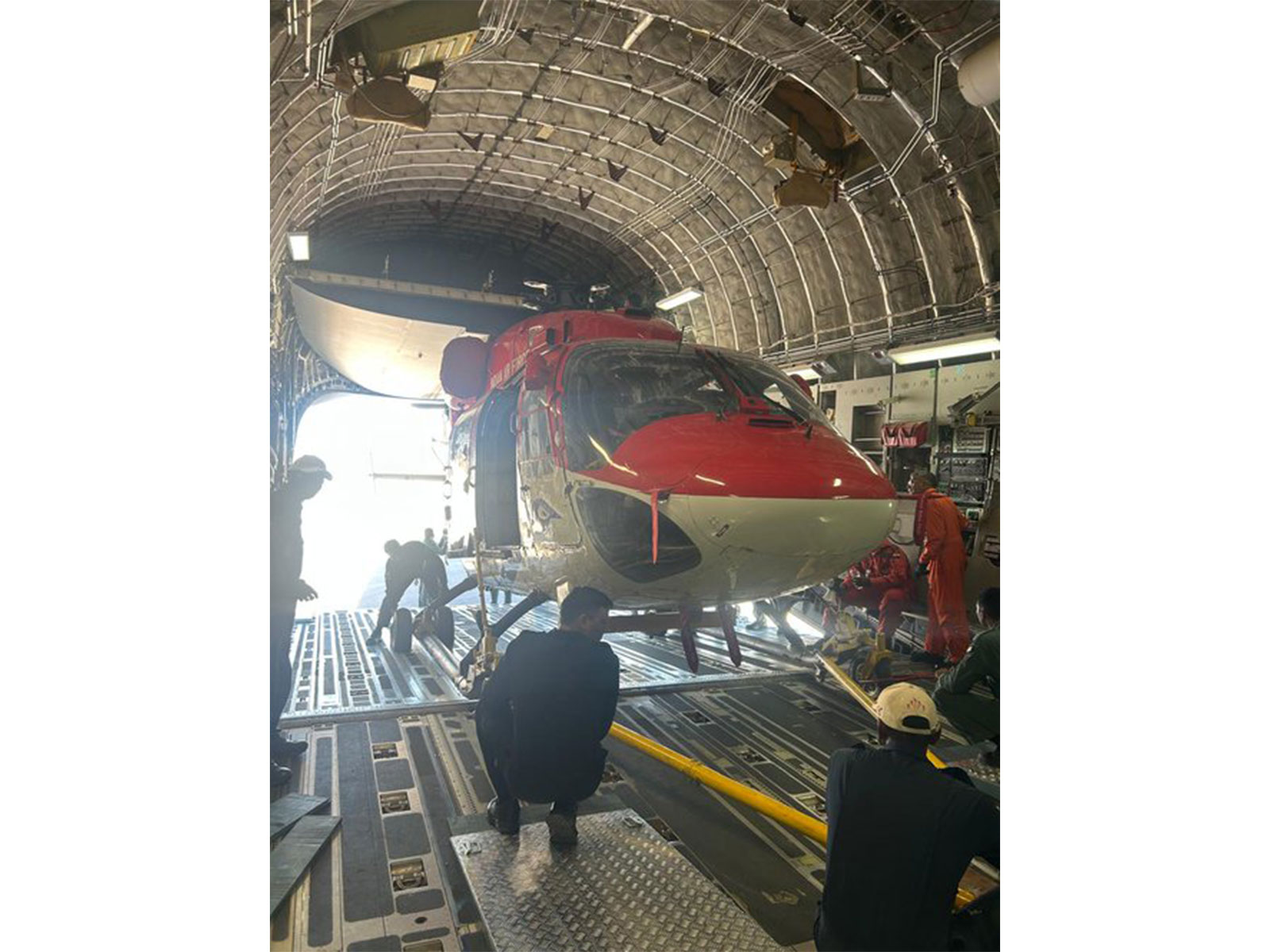 Advanced Light Helicopter (ALH) Dhruv of the Indian Air Force's Sarang Display Team being loaded inside a transport aircraft. (Photo: X/@indembcairo)
