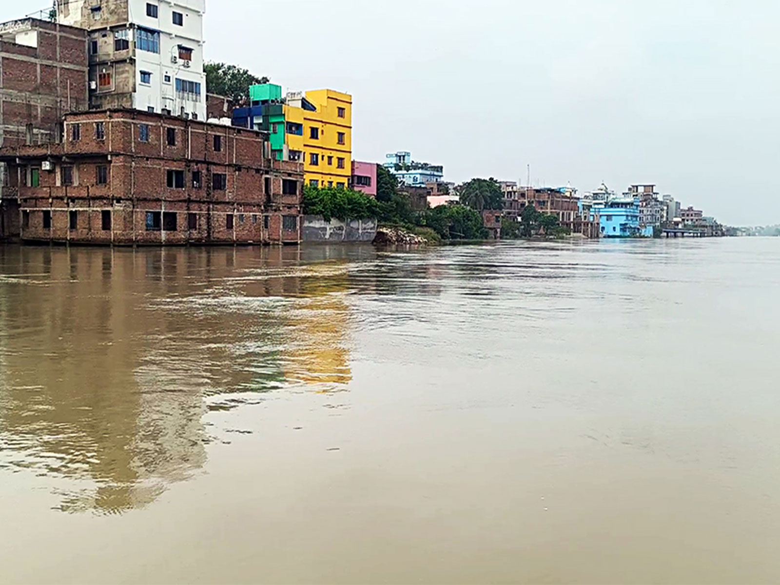 Residential and commercial buildings remain partially submerged as the swollen Ganga River continues to flow above the danger mark in Bhagalpur (Photo/ANI)
