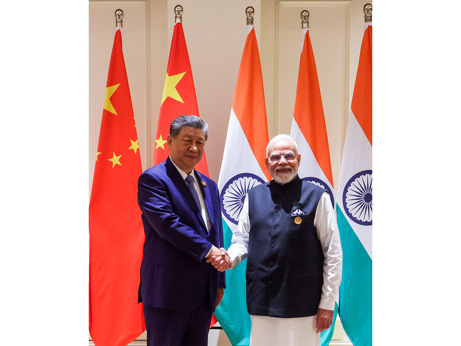 Prime Minister Narendra Modi and Chinese President Xi Jinping exchange a handshake during a bilateral meeting at the 18th BRICS Summit, in New Delhi (Photo/ANI)
