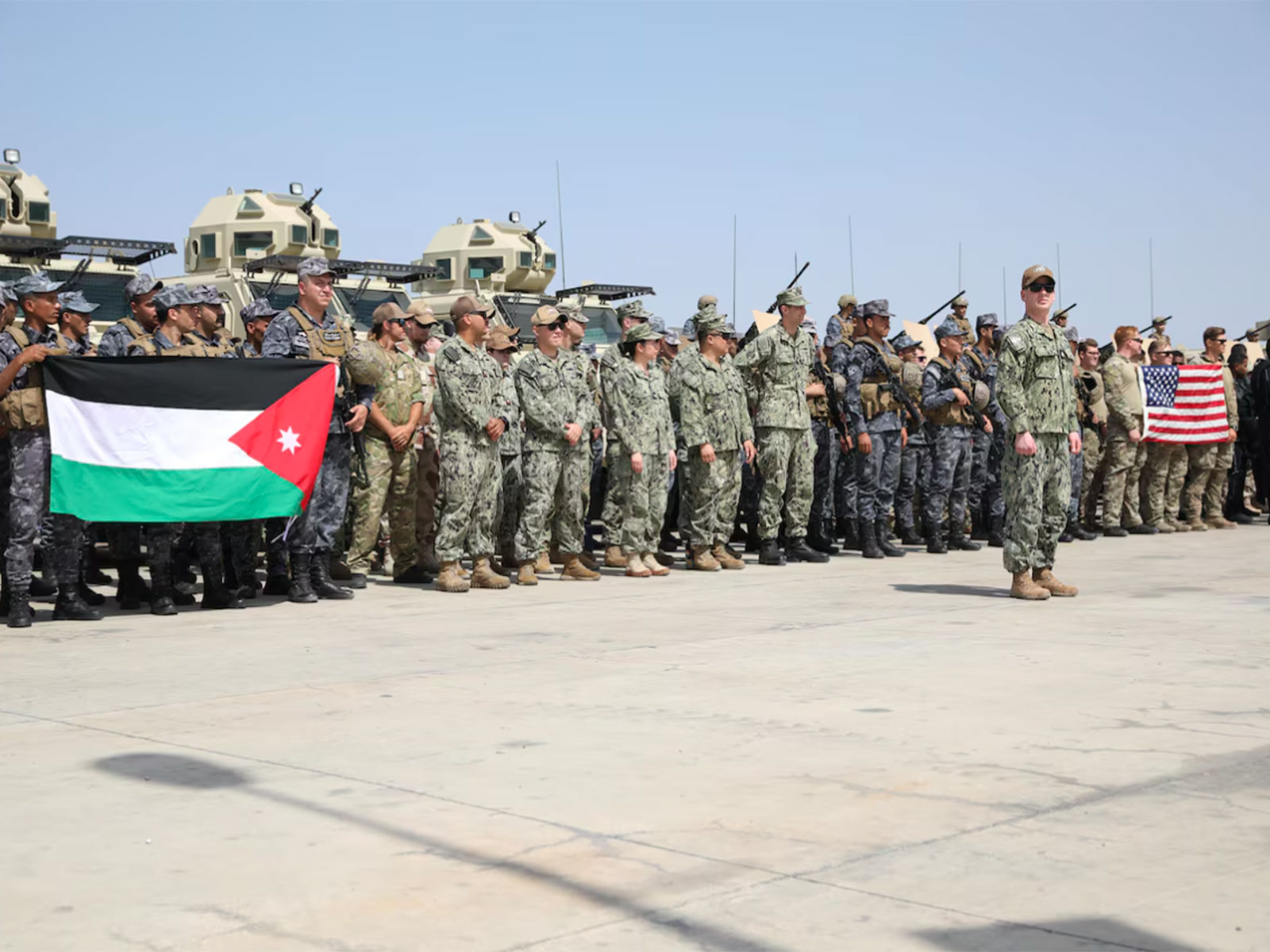Members of the U.S. Navy and Royal Jordanian Navy stand in formation during the opening ceremony for Eager Lion 24 at Aqaba, Jordan, May 12, 2024 (Photo/war.gov)