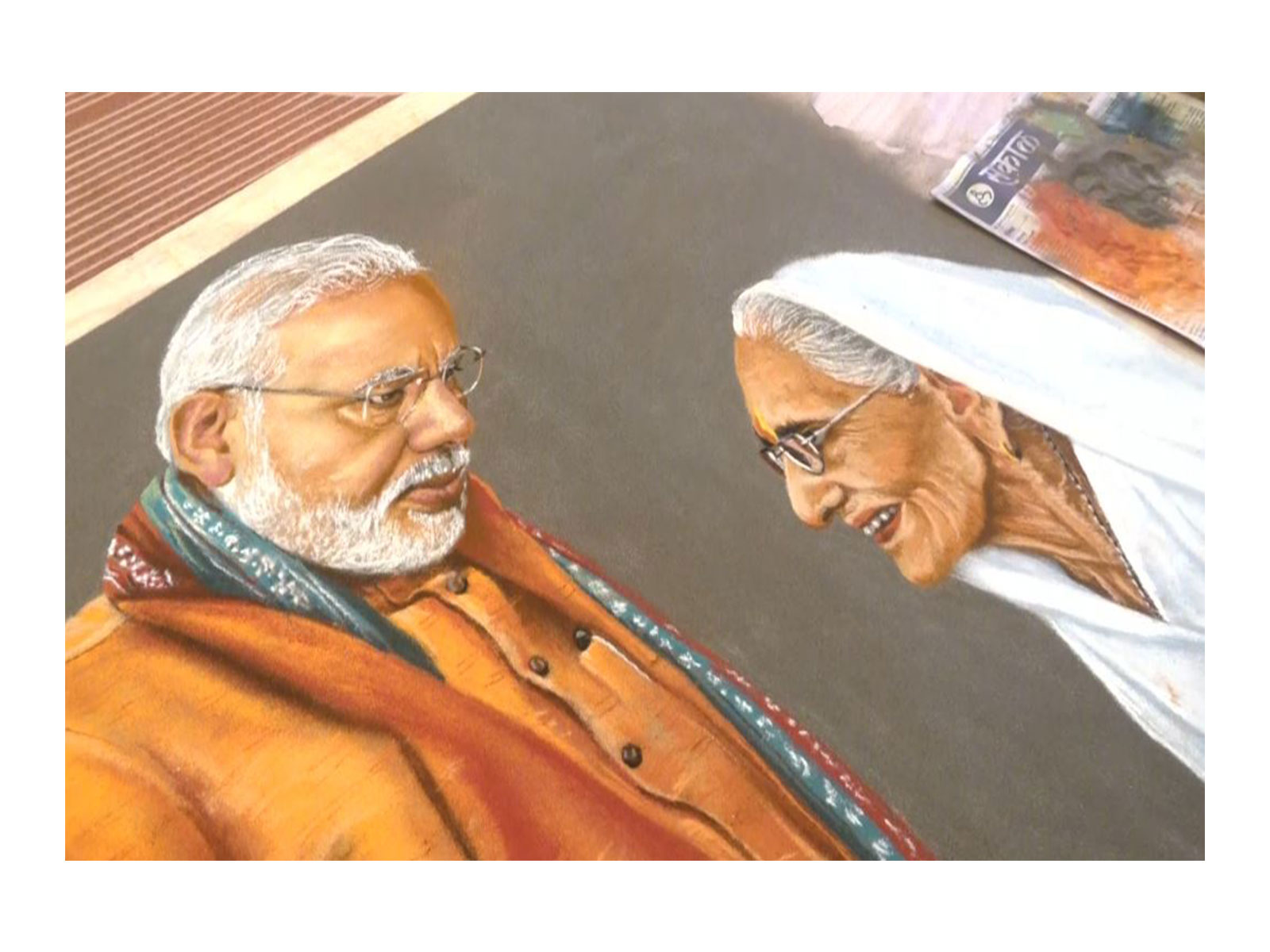 Rangoli artist Somnath Bhongle from Pune has created a special portrait of PM Modi and his late mother (Photo/ANI)