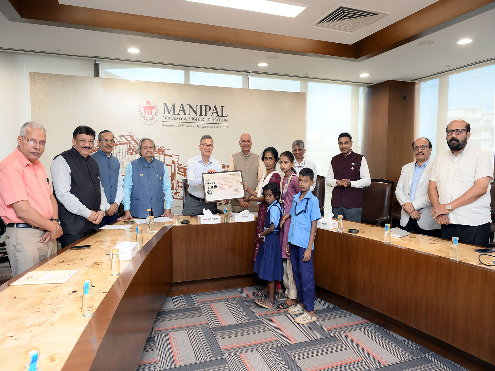 Dr Ranjan R. Pai, President, MAHE Trust, with the beneficiary family at the launch of the housing initiative for families of economically weaker students in Manipal