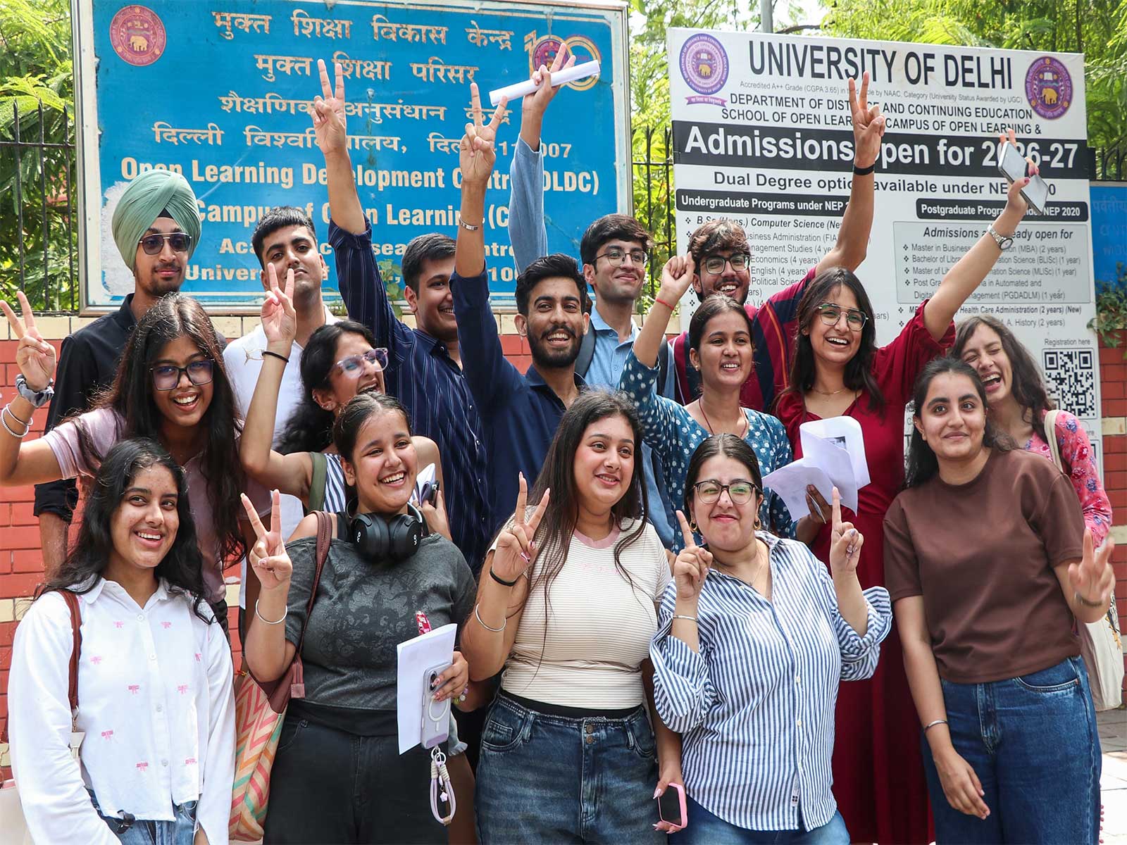 Students show victory signs at North Campus in New Delhi on Friday (Photo/ANI)