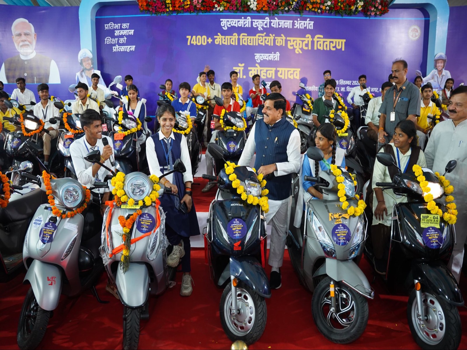 MP CM Mohan Yadav distributes scooties to meritorious Class 12 students (Photo/ X @CMMadhyaPradesh)