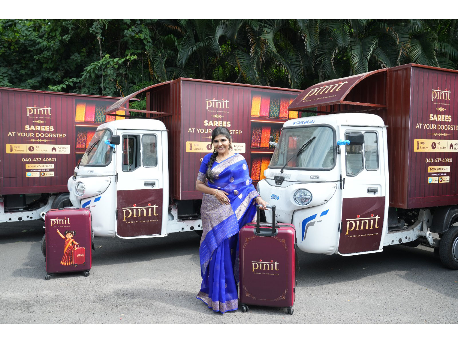 Sangeetha Rajesh, Founder, Pinit with the brand all electric fleet showcasing a suitcase of curated sarees that will be taken to customers doorstep
