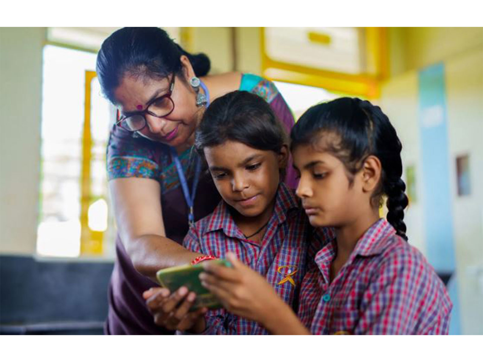 A teacher demonstrates an EdTech app to her students, part of ShikshaNext's  market-shaping push to bring proven digital tools into Indian classrooms