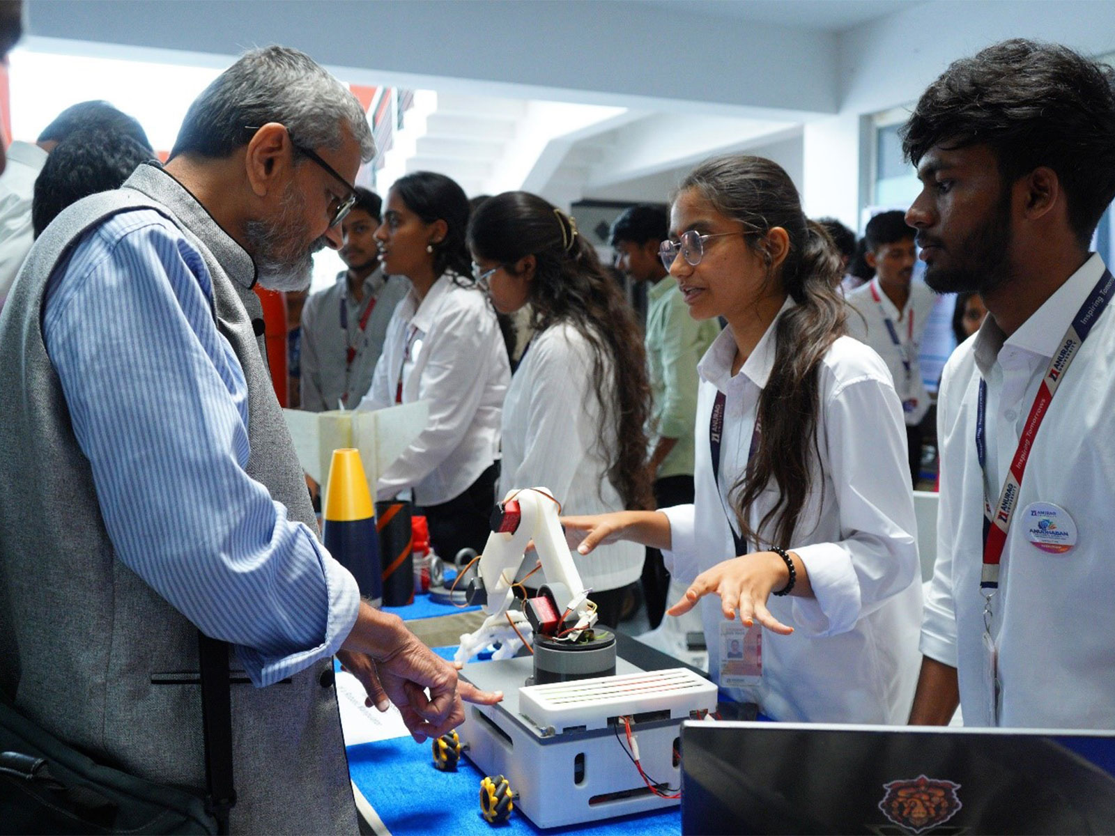 Dr. U. B. Desai, Chancellor, Anurag University, engaging with researchers and participants, exchanging ideas on research and innovation.