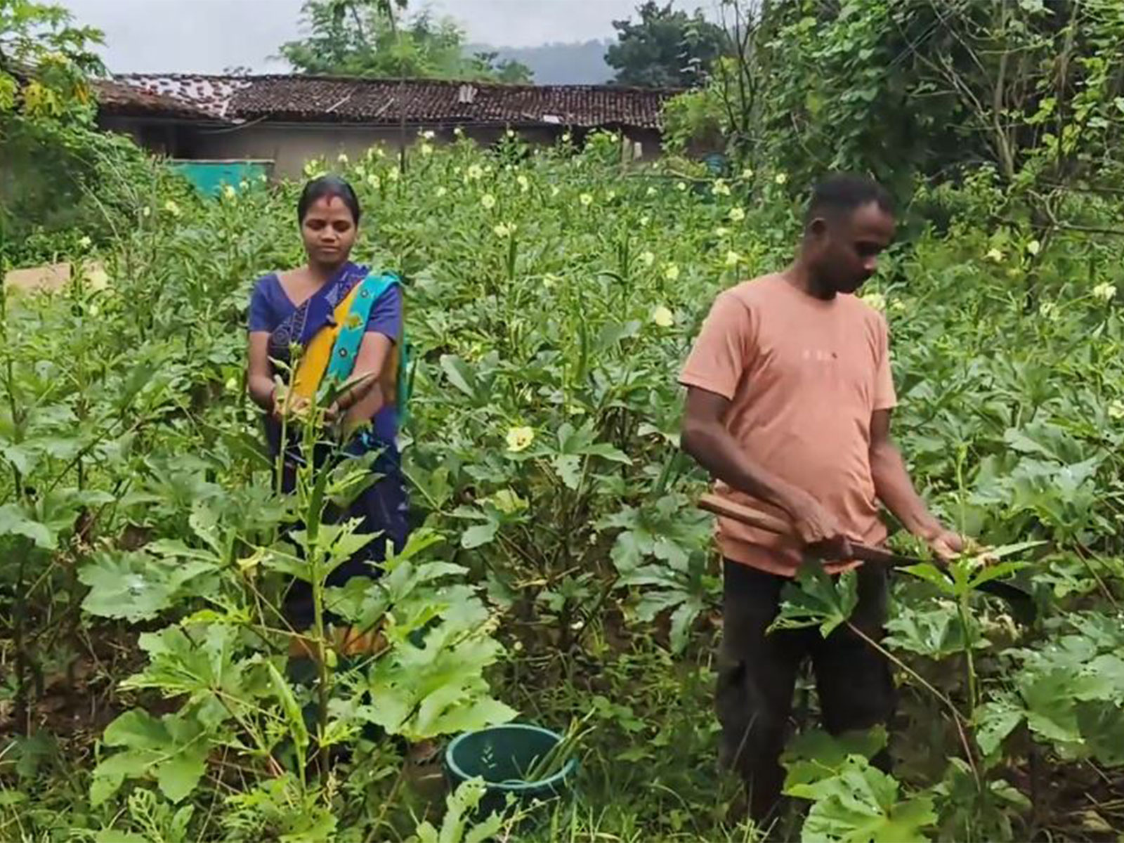 Former Naxal commander Sitaram Sonwani and his wife outside their newly constructed Pradhan Mantri Awas Yojana house in Balrampur, Chhattisgarh. (Photo: ANI)