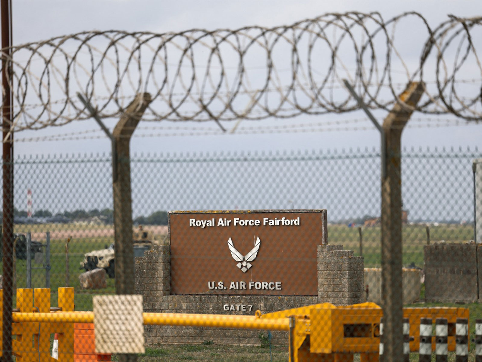 A sign stands behind a fence at the RAF Fairford airbase in UK after police declared a major incident at the base (Photo/Reuters)