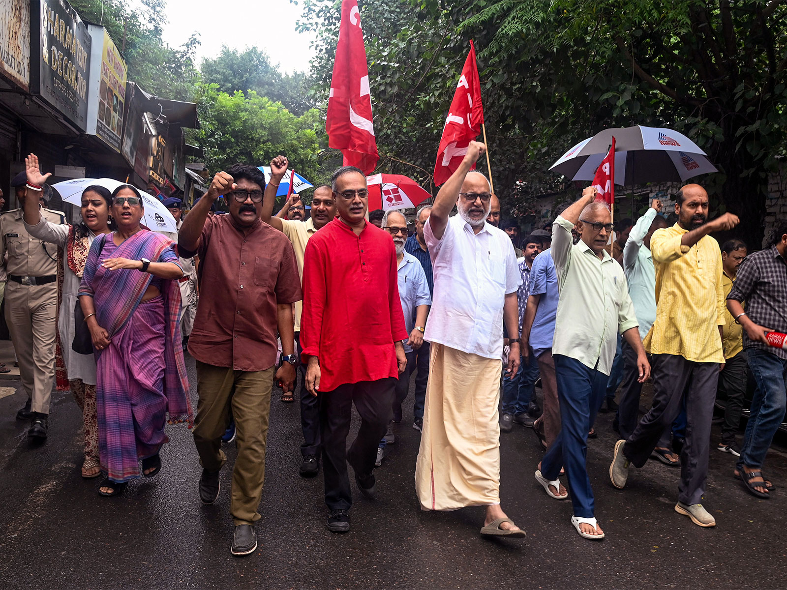 CPI(M) General Secretary MA Baby leads march to Gole Market in Delhi (Photo/ANI)