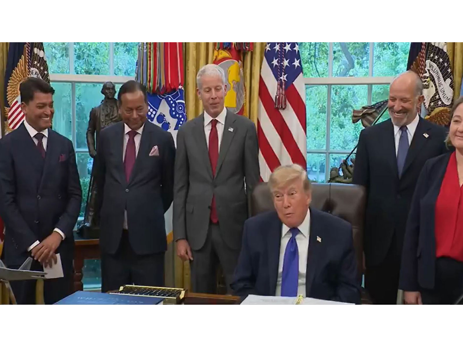 US President Donald Trump during the announcement of an USD 18 billion Essar Group steel investment, flanked by Mesabi Metallics chairman Rewant Ruia and Essar co-founder Ravi Ruia. (Photo: White House/YouTube)