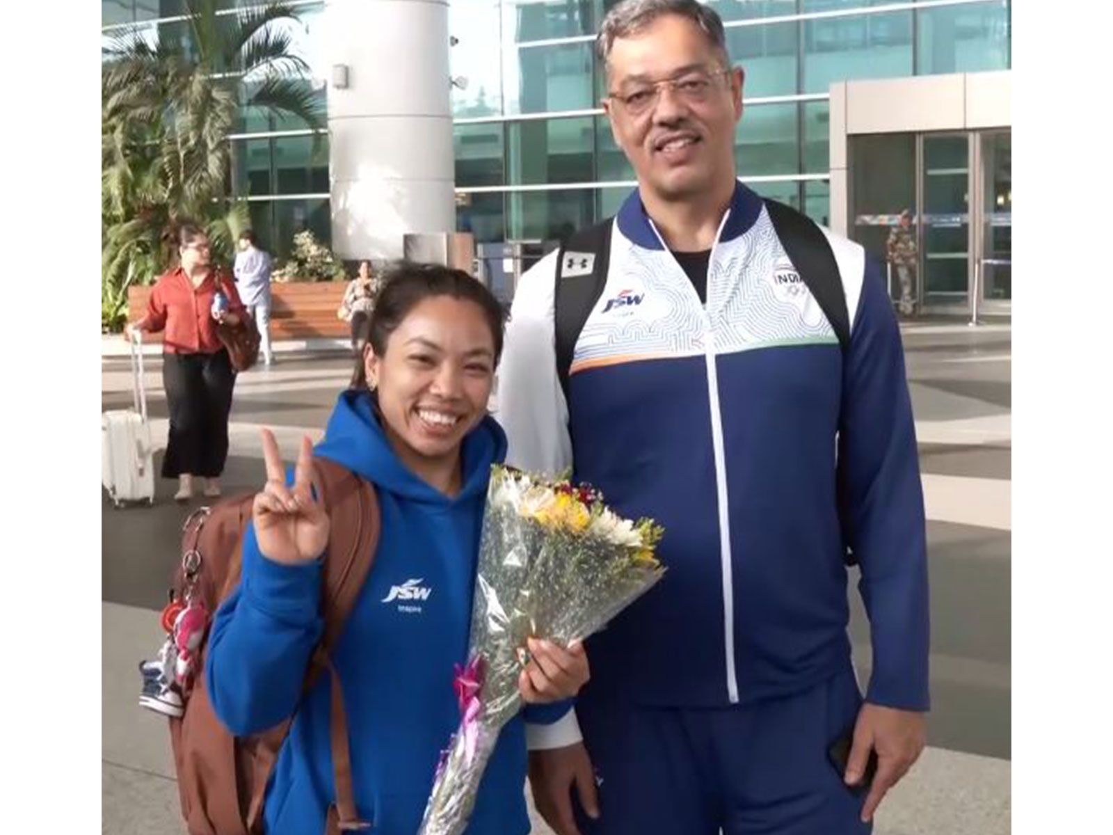 Weightlifting star Mirabai Chanu (L) with her coach Vijay Sharma. (Photo: ANI)