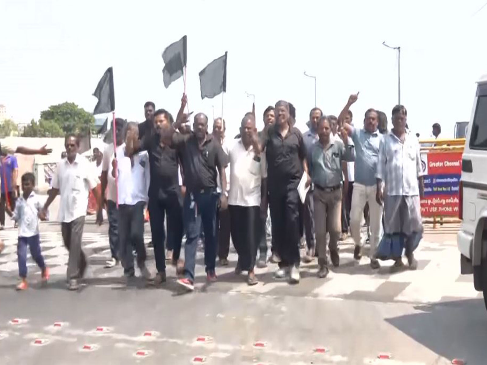 Fishermen raise black flags during protest in Chennai's Pattinapakkam (Photo/ANI)
