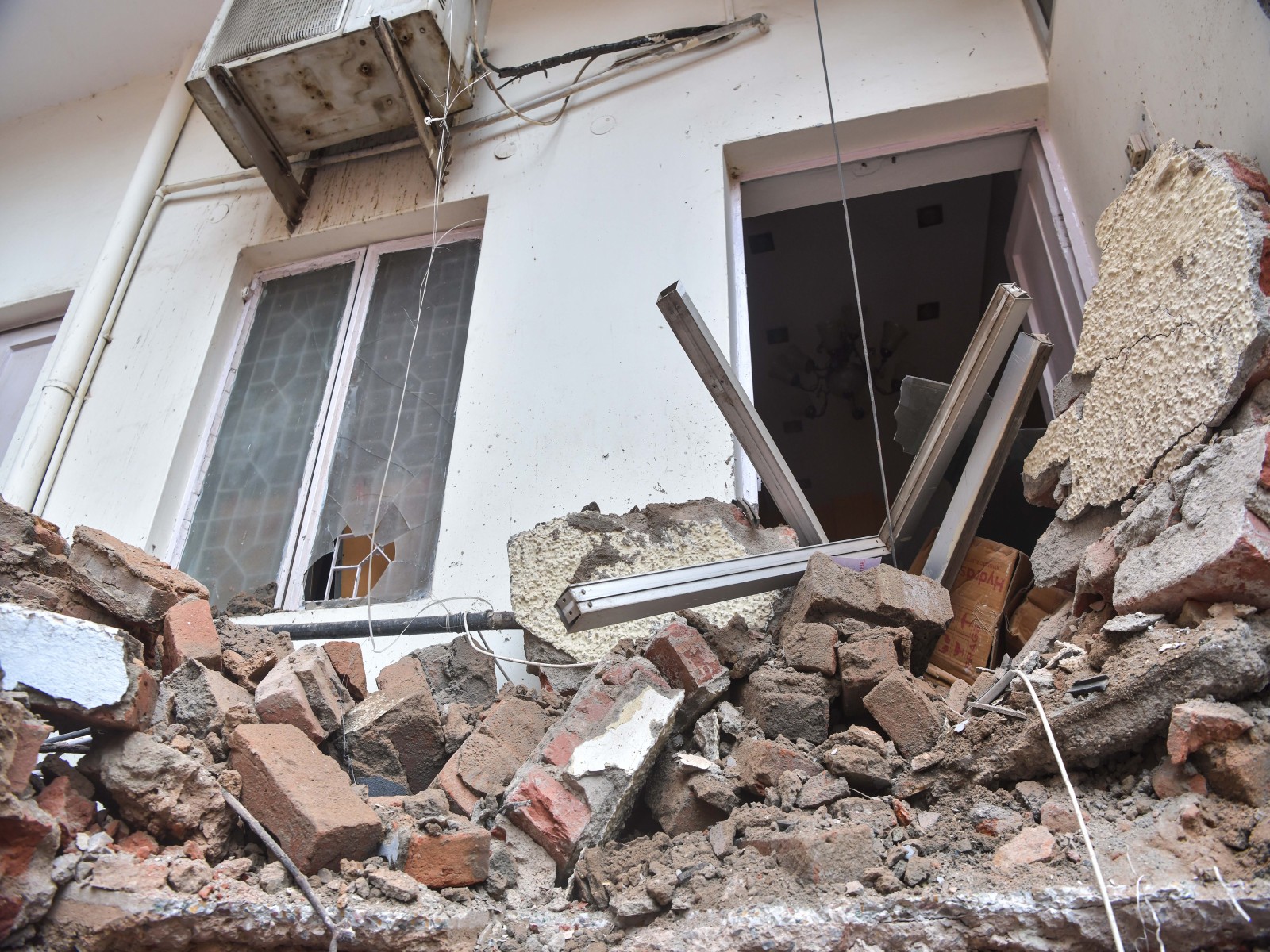 A view of the debris accumulated outside a house after a building collapsed near Satya Niketan at South-West Delhi (Photo/ANI)