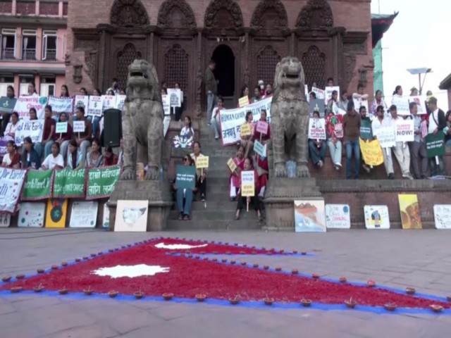Climate justice protest and candle light vigil continues in Nepal (Photo/ANI)