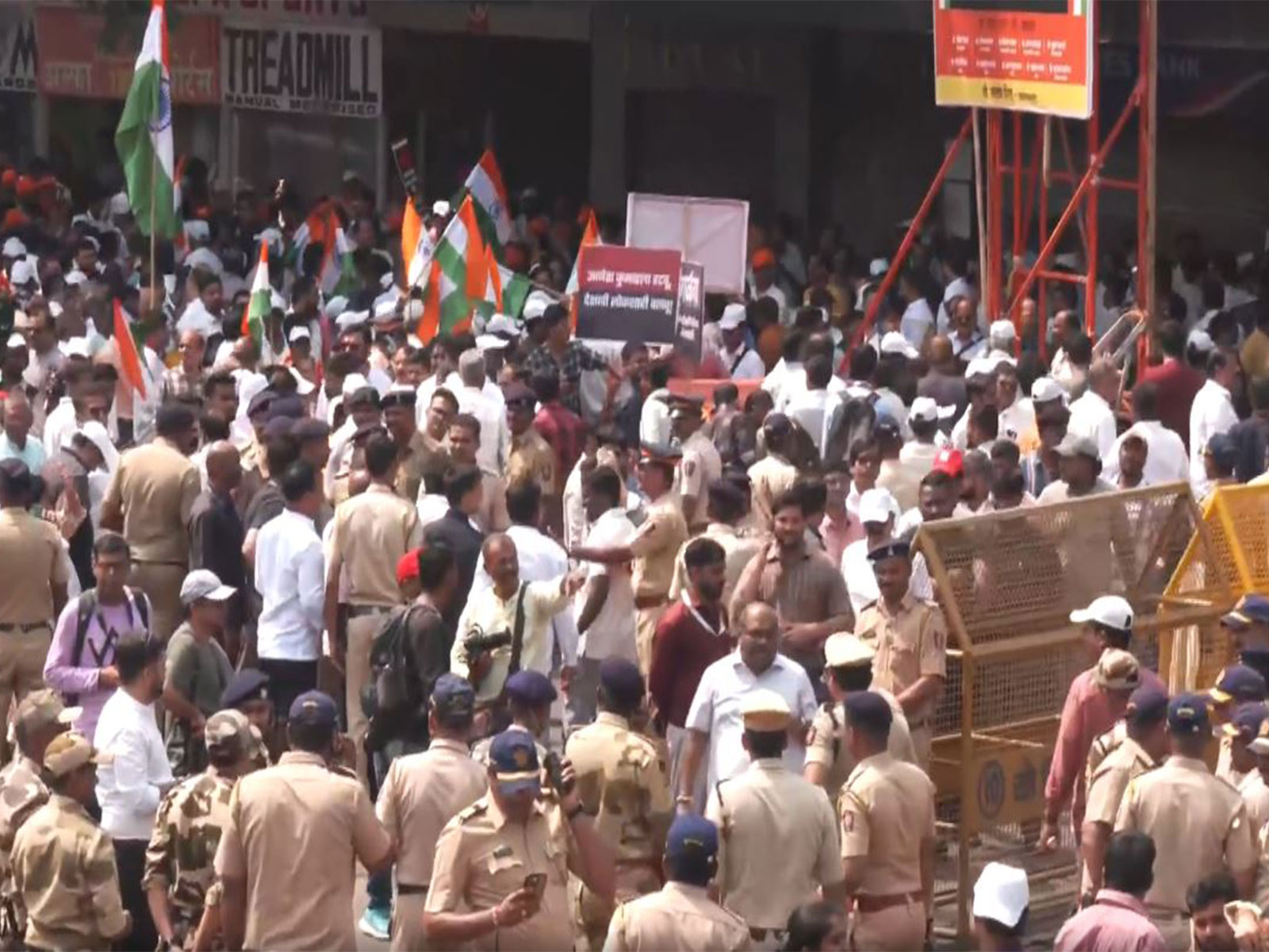 People gather at Mumbai’s Metro Cinema ahead of Uddhav, Raj Thackeray’s protest march (Photo/ANI)