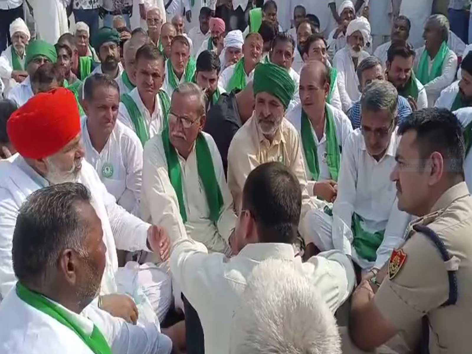 BKU leader Rakesh Tikait sits in protest during a farmers’ agitation (Photo/ANI)