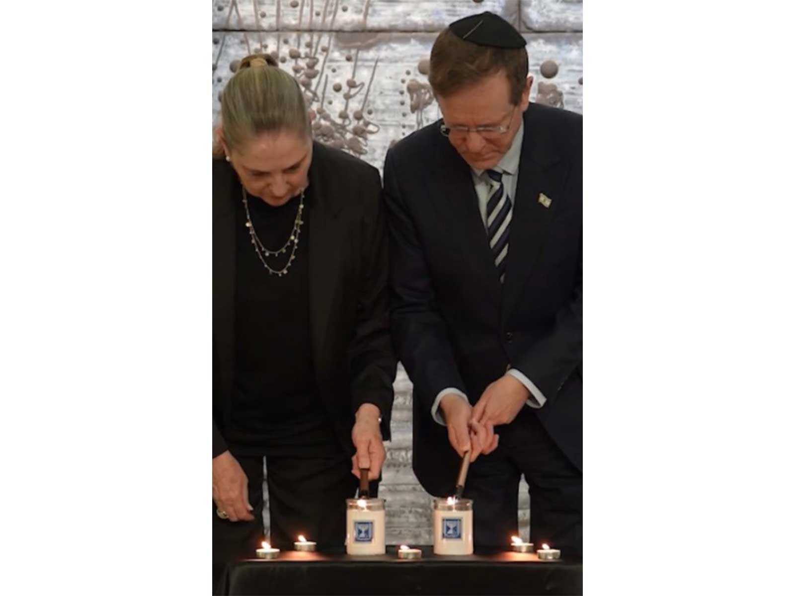 Israeli President Isaac Herzog lights memorial candle at President's Residence on October 7 attacks anniversary (Photo/X/@Isaac_Herzog)