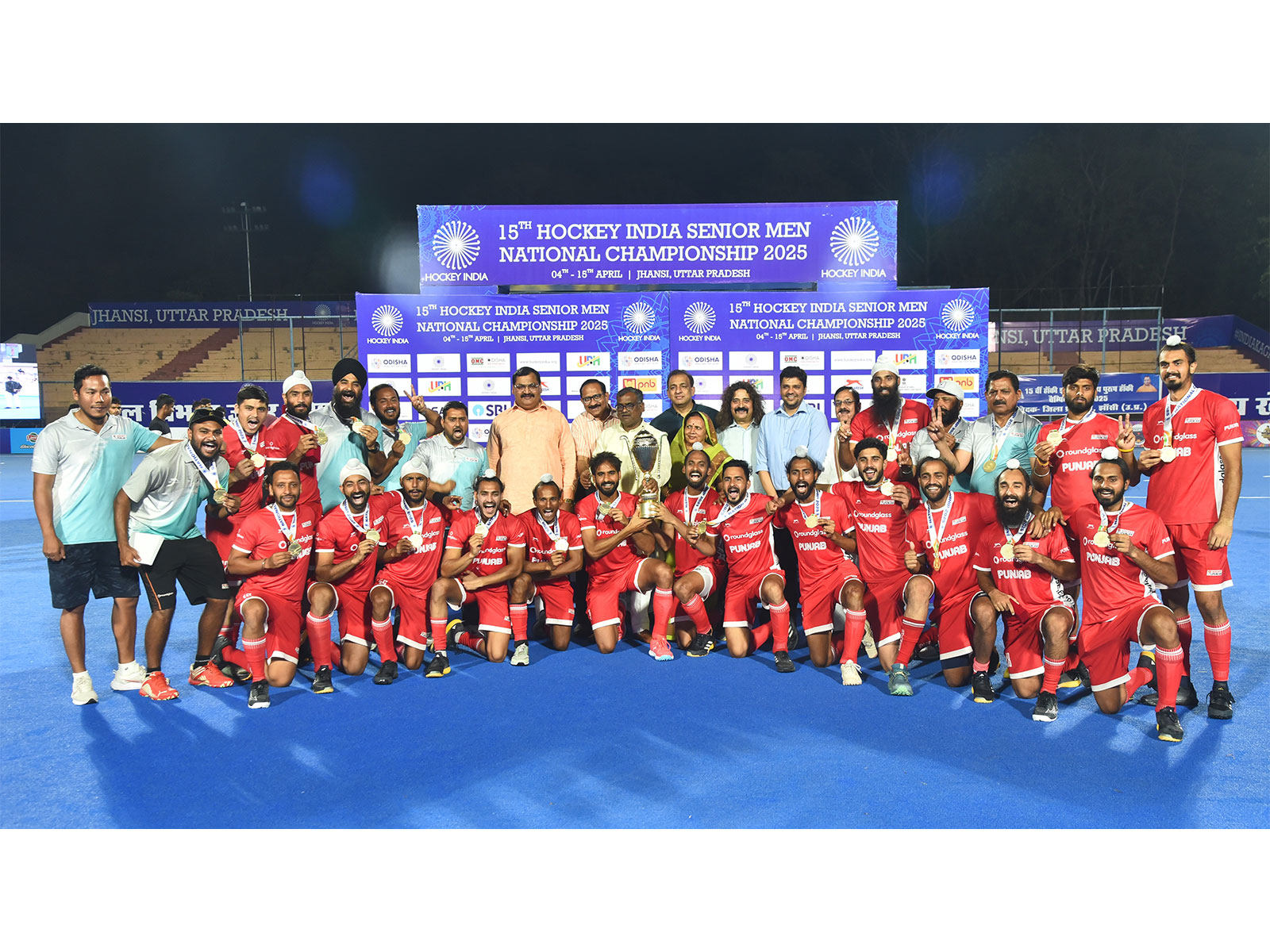 Hockey Punjab lifting National Championship 2025 trophy (Image: HI)