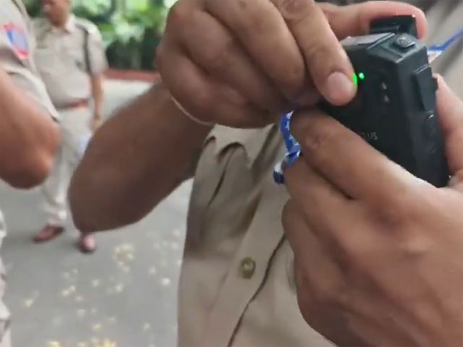 Delhi Police personnel use body cameras on their uniform (Photo/ANI)