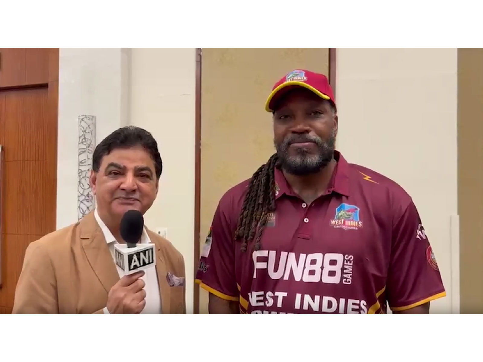 Chris Gayle (R) and West Indies Champions owner Ajay Sethi (L). (Photo/ANI)