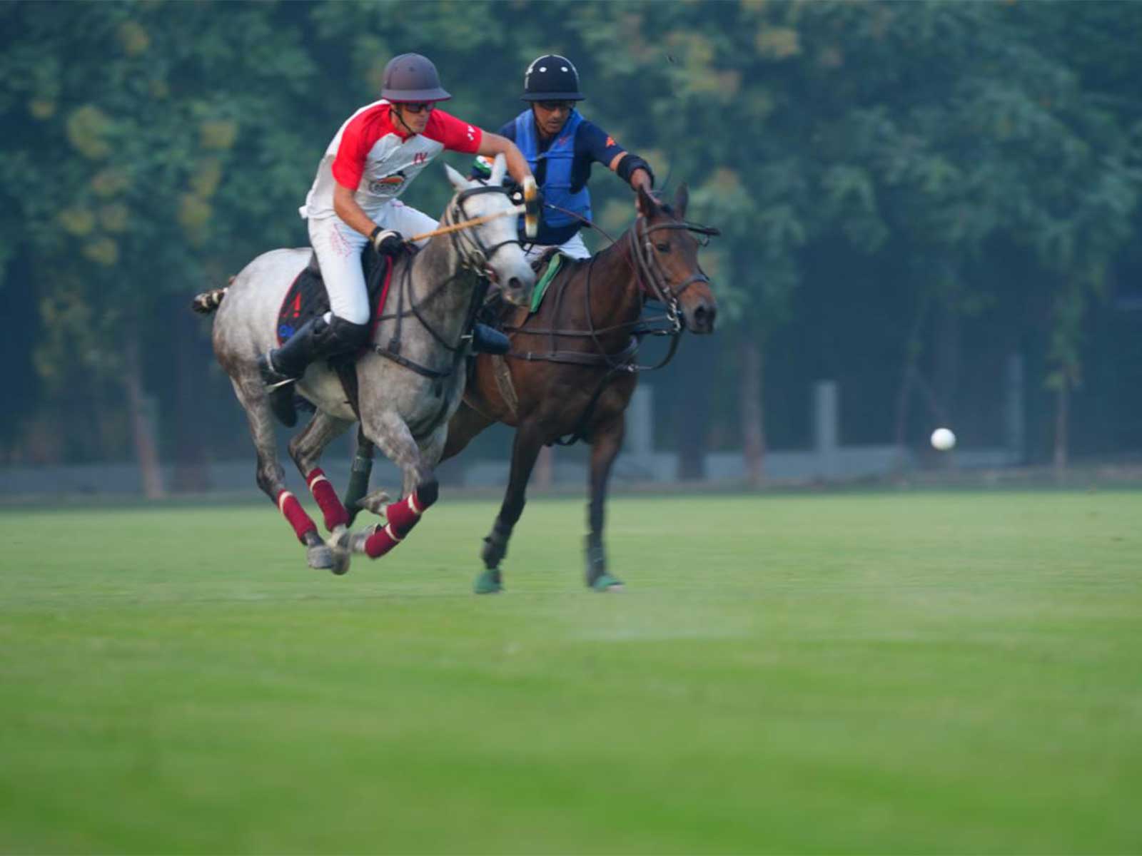 Naveen Jindal (R) swift on the ride to snatch control on the polo field. (Photo: Jindal Panther Cup)