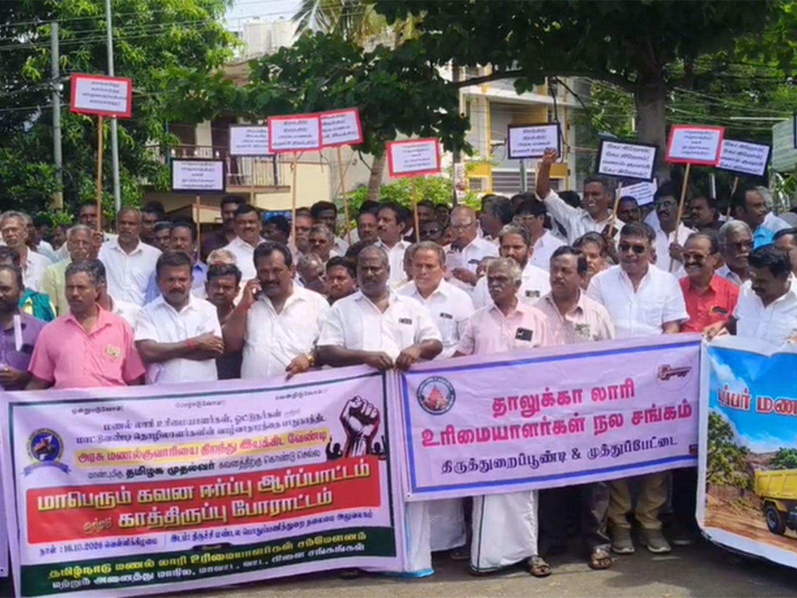 Lorry owners and drivers protest infront of PwD office in Tiruchirappalli (Photo/ANI)