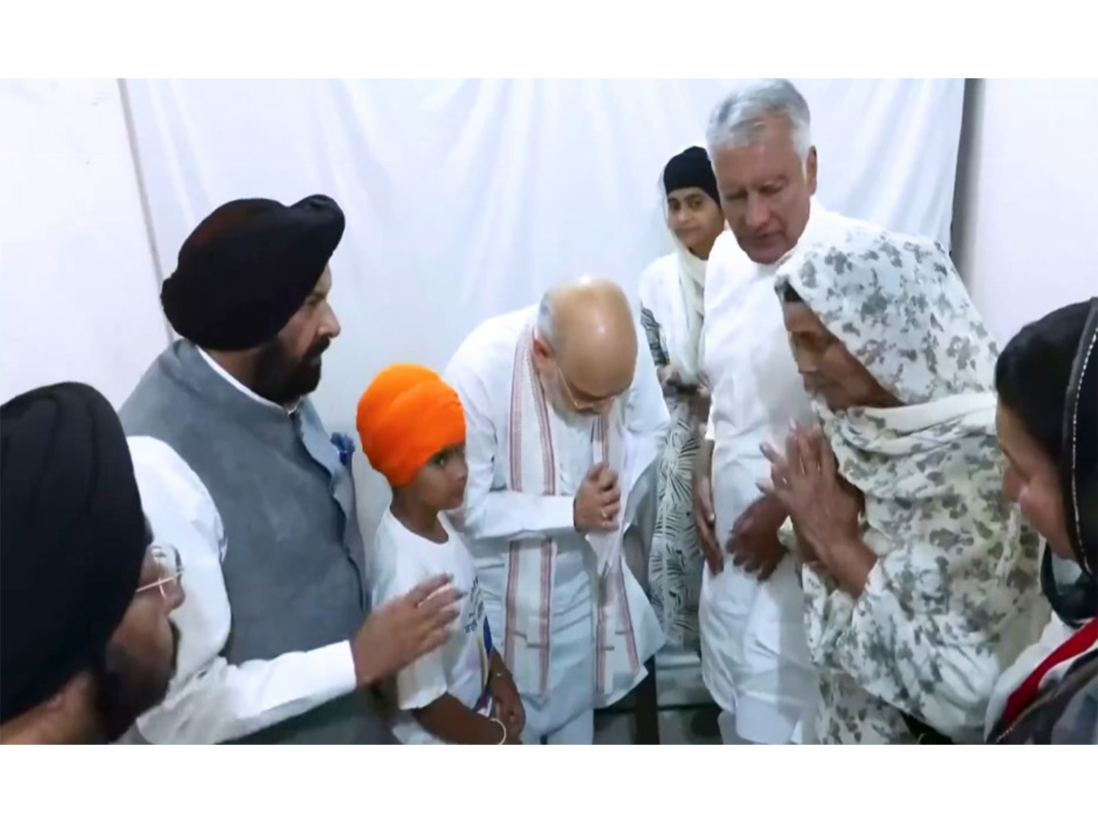 Union Home Minister Amit Shah meets the family of anti-drug activist Parvinder Singh Jhota (Photo/ANI)