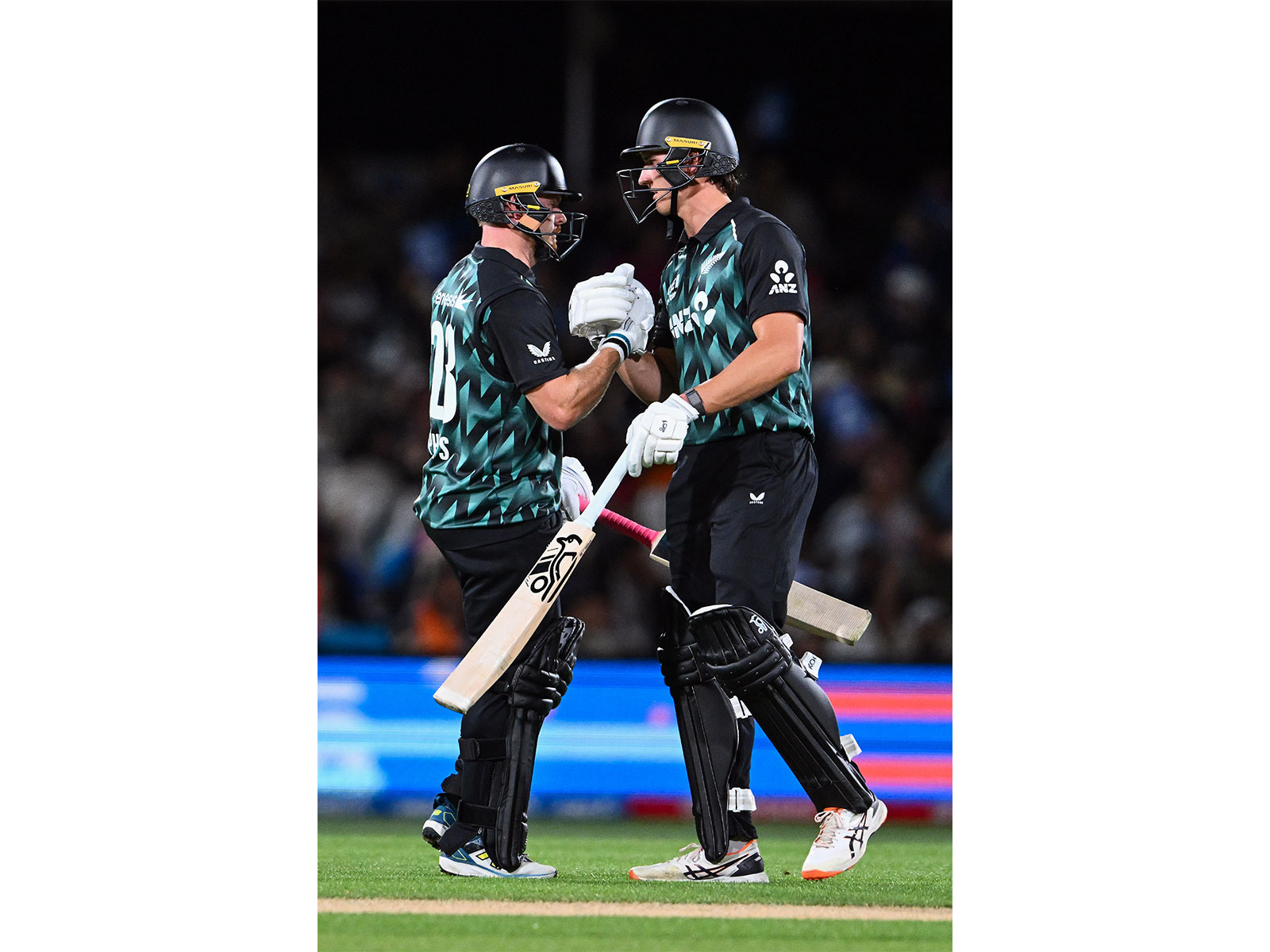 New Zealand's Glenn Phillips (L) celebrates his half-century with teammate Bevon Jacobs (R) during the 2nd T20I (Photo: ANI)