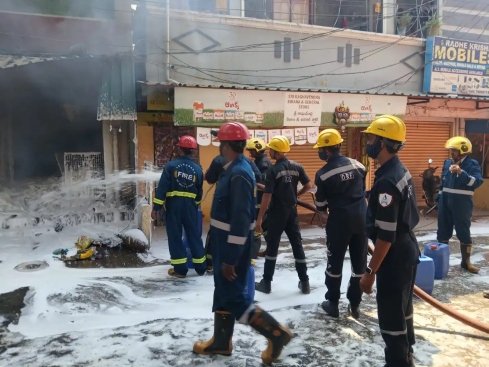 Fire fighters dosuing the flames at the scrap godowan (Photo/Fire officials) 