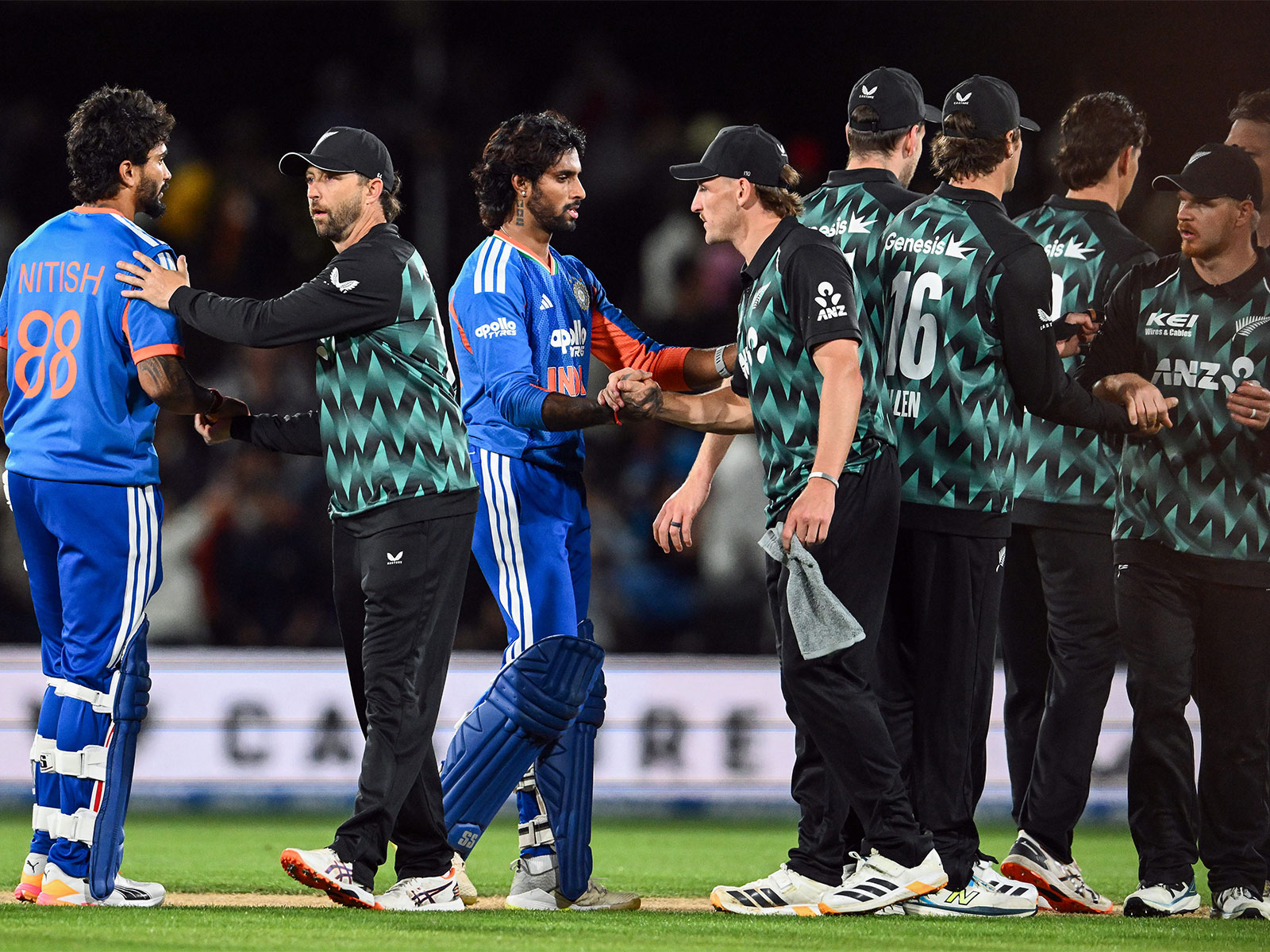 India's Nitish Kumar Reddy and Tilak Varma shake hands with New Zealand players. (Photo/ANI)