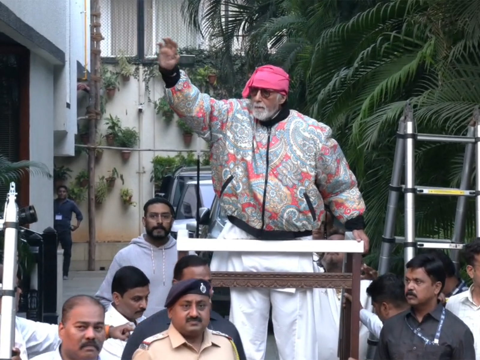 Amitabh Bachchan greets fans outside Jalsa amid heavy security along with Abhishek Bachchan (Photo/ANI) 