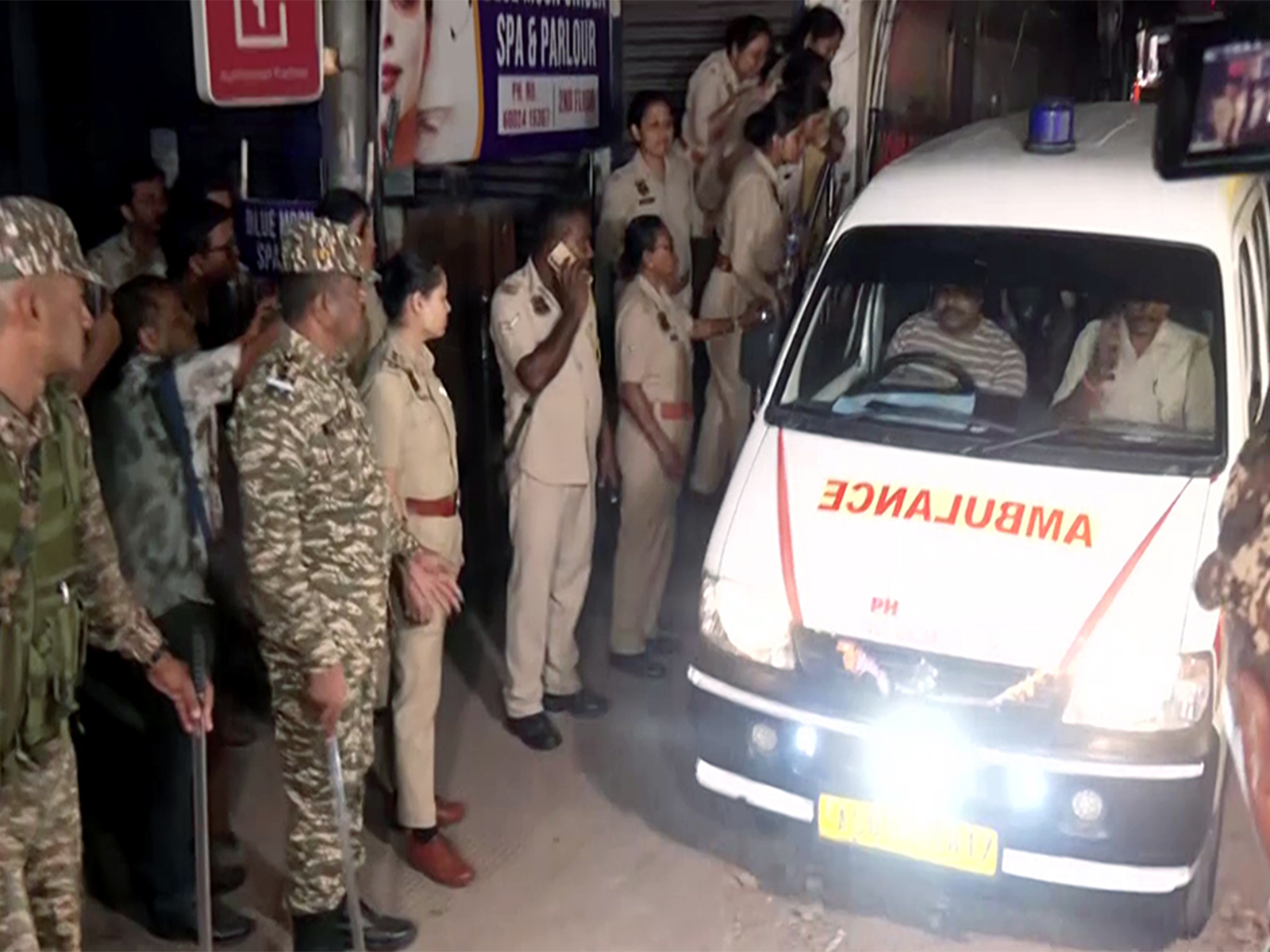 An ambulance leaves the spot where five people were killed in a firing incident near a hotel in the Ulubari area, in Guwahati on Tuesday (Photo/ANI)