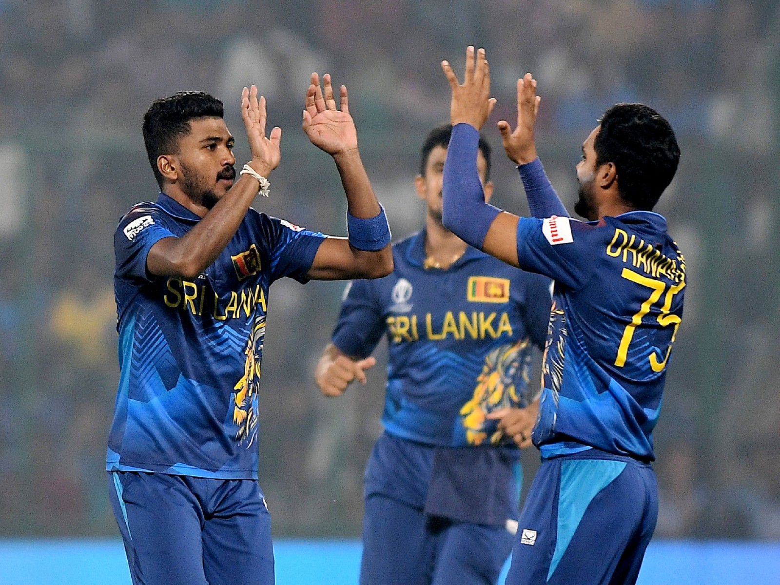 Sri Lankan bowler Dilshan Madushanka (L) celebrating a wicket with his teammates. (Photo: ANI)