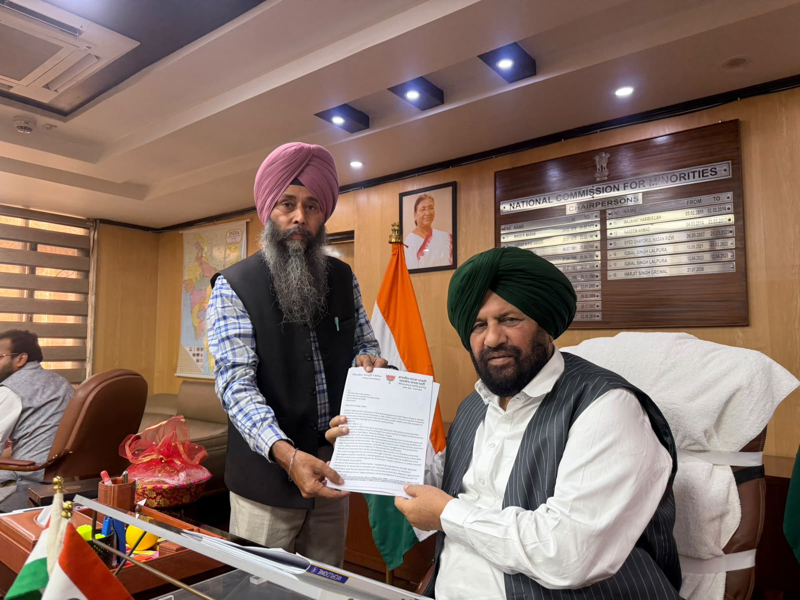 Hardev Singh Ubha, Senior Leader, BJP Punjab, with Harjit Singh Grewal, Chairman, National Commission for Minorities, at the Commission’s office in New Delhi. (Photo/ANI)