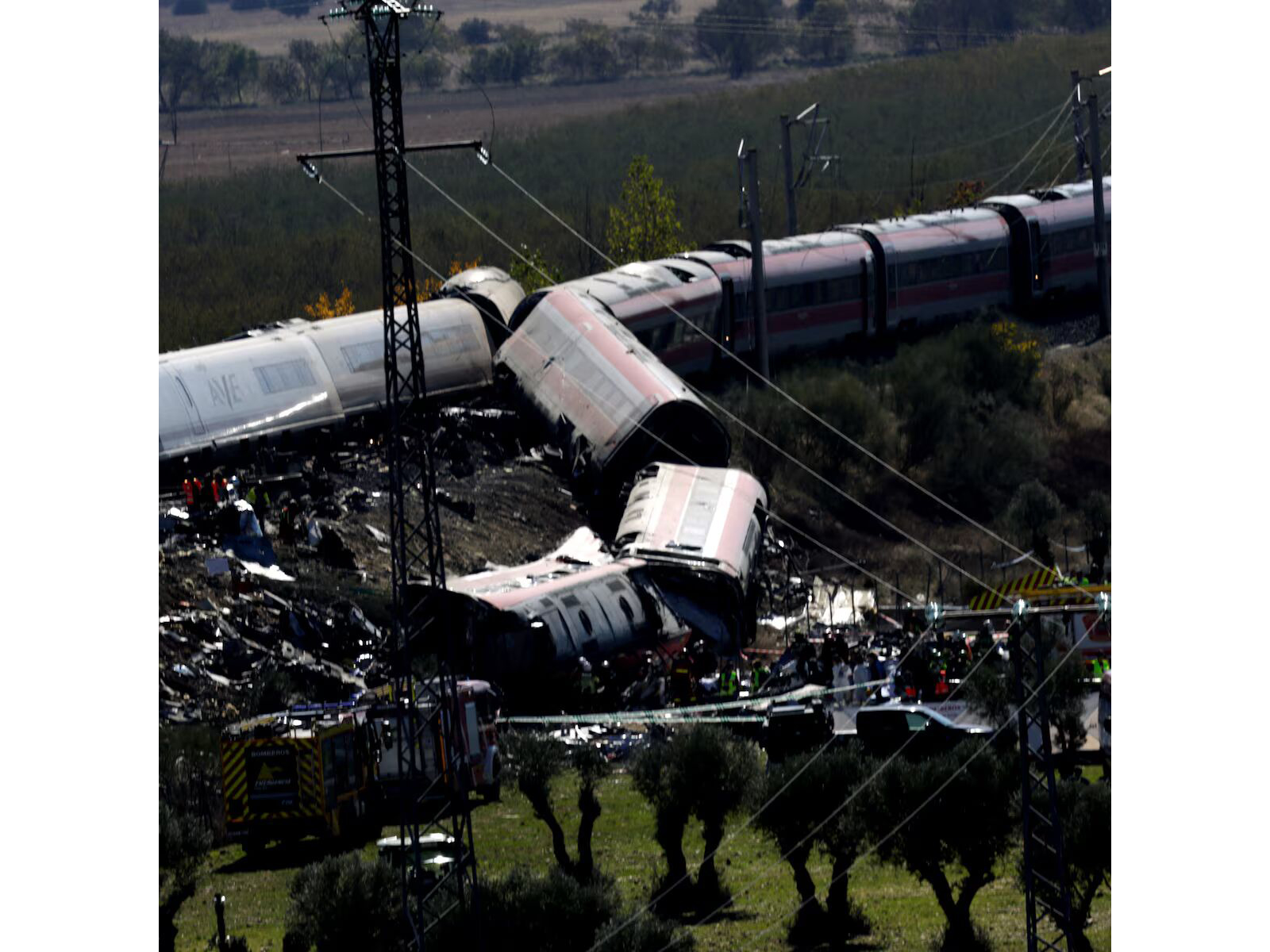 Rescue personnel work at the site of the collision of two high-speed trains between the towns of Mora and Orgaz, near Toledo, Spain. (Photo/Reuters)