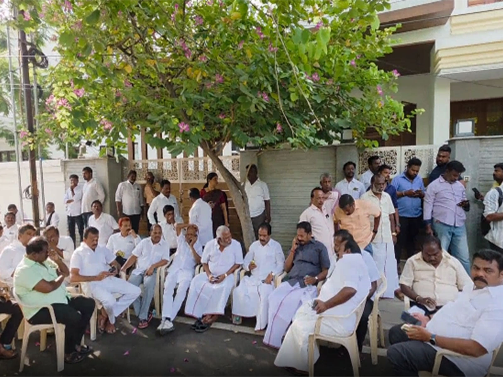 DMK cadres gathered outside former DMK minister K N Nehru's residence (Photo/ANI)