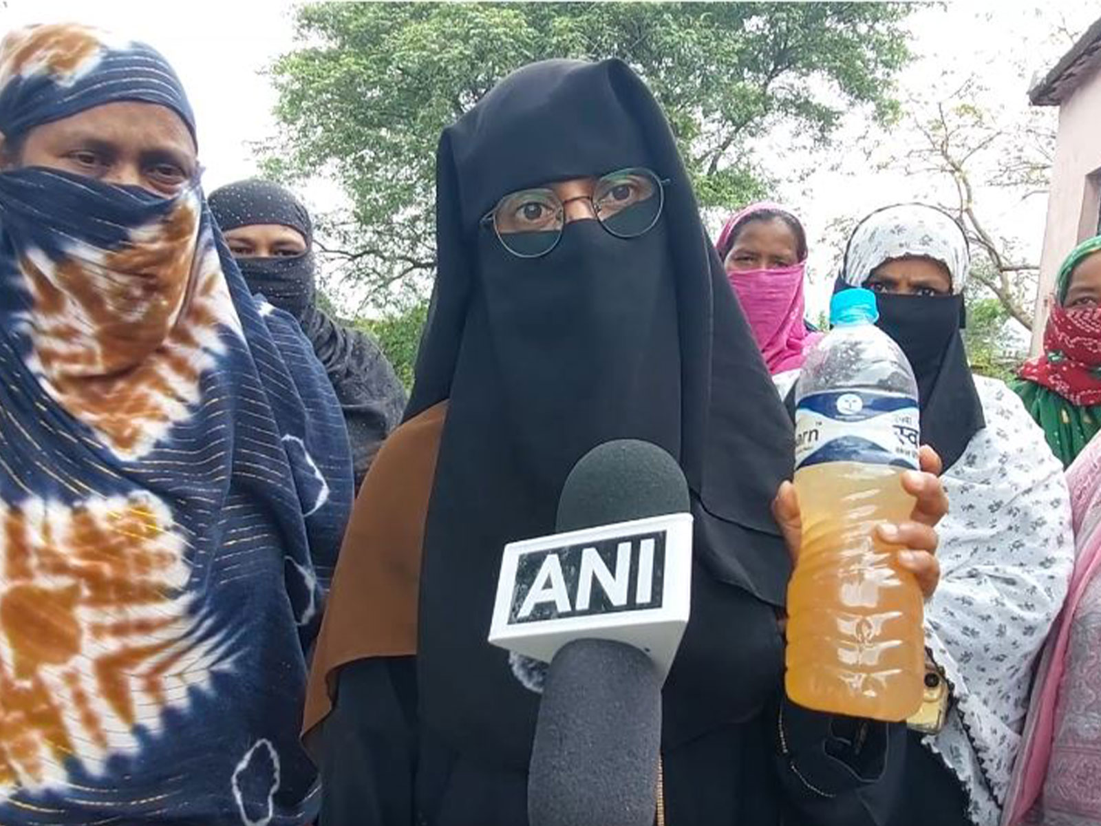 A resident showing contaminated drinking water supplied to the village in Mayurbhanj district, Odisha (Photo/ANI)