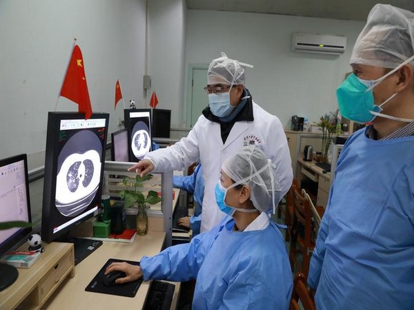 Medical workers inspect the CT scan image of a patient at the Zhongnan Hospital of Wuhan University following an outbreak of the new coronavirus in Wuhan. Medical workers inspect the CT scan image of a patient at the Zhongnan Hospital of Wuhan University following an outbreak of the new coronavirus in Wuhan.
